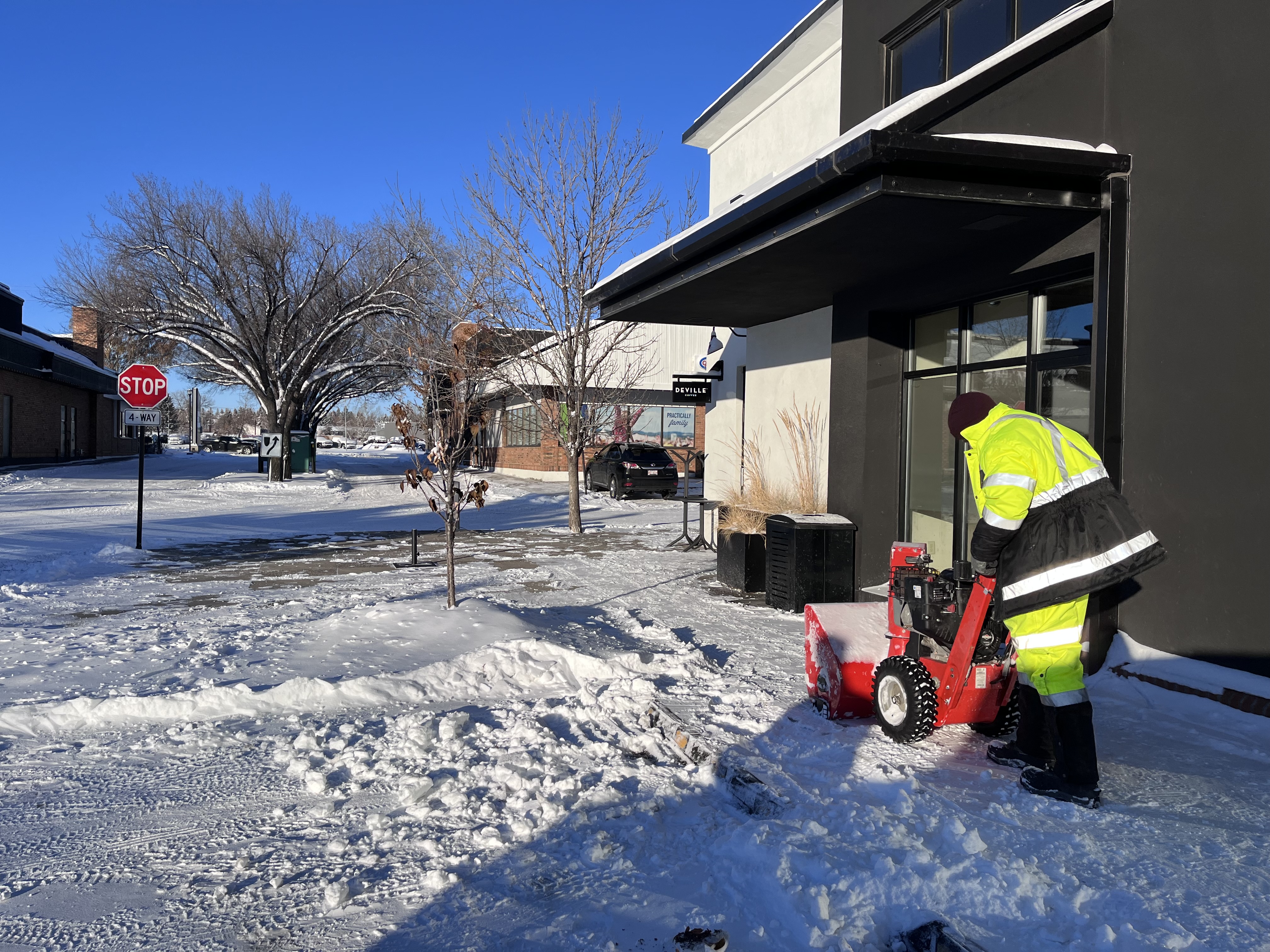 ArborCare snow removal clearing sidewalk